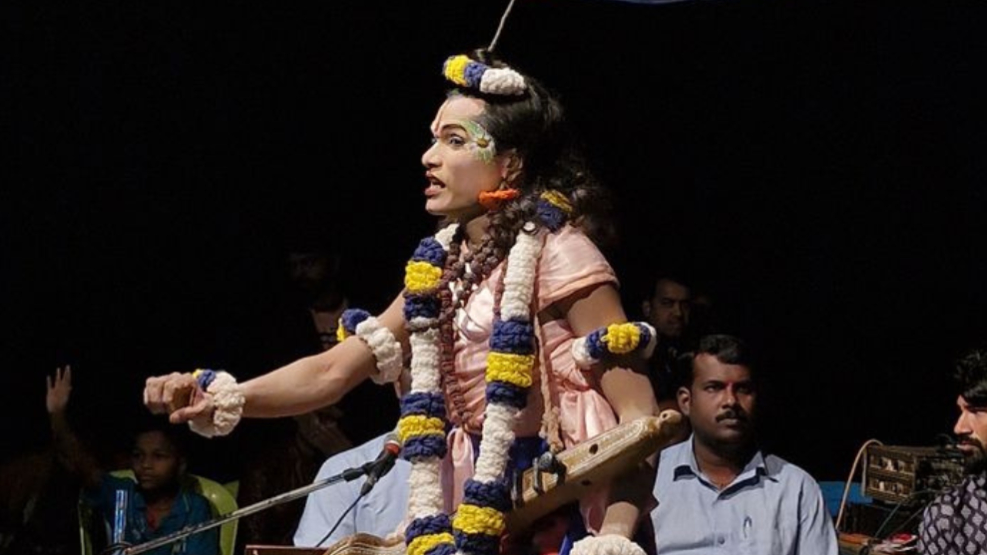 Dashavatar folk artist performing in full costume on stage